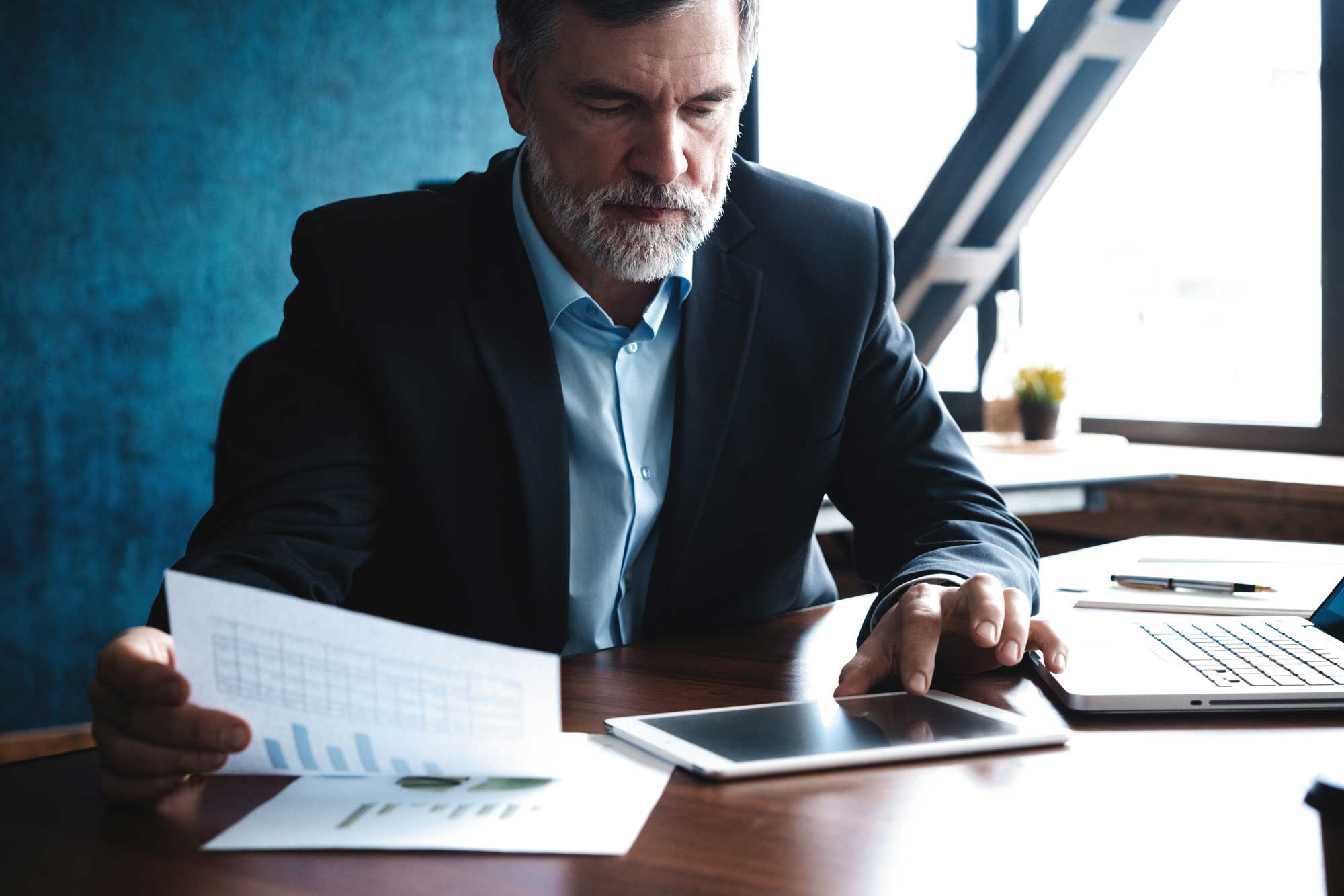 Financial professionals looking at computer