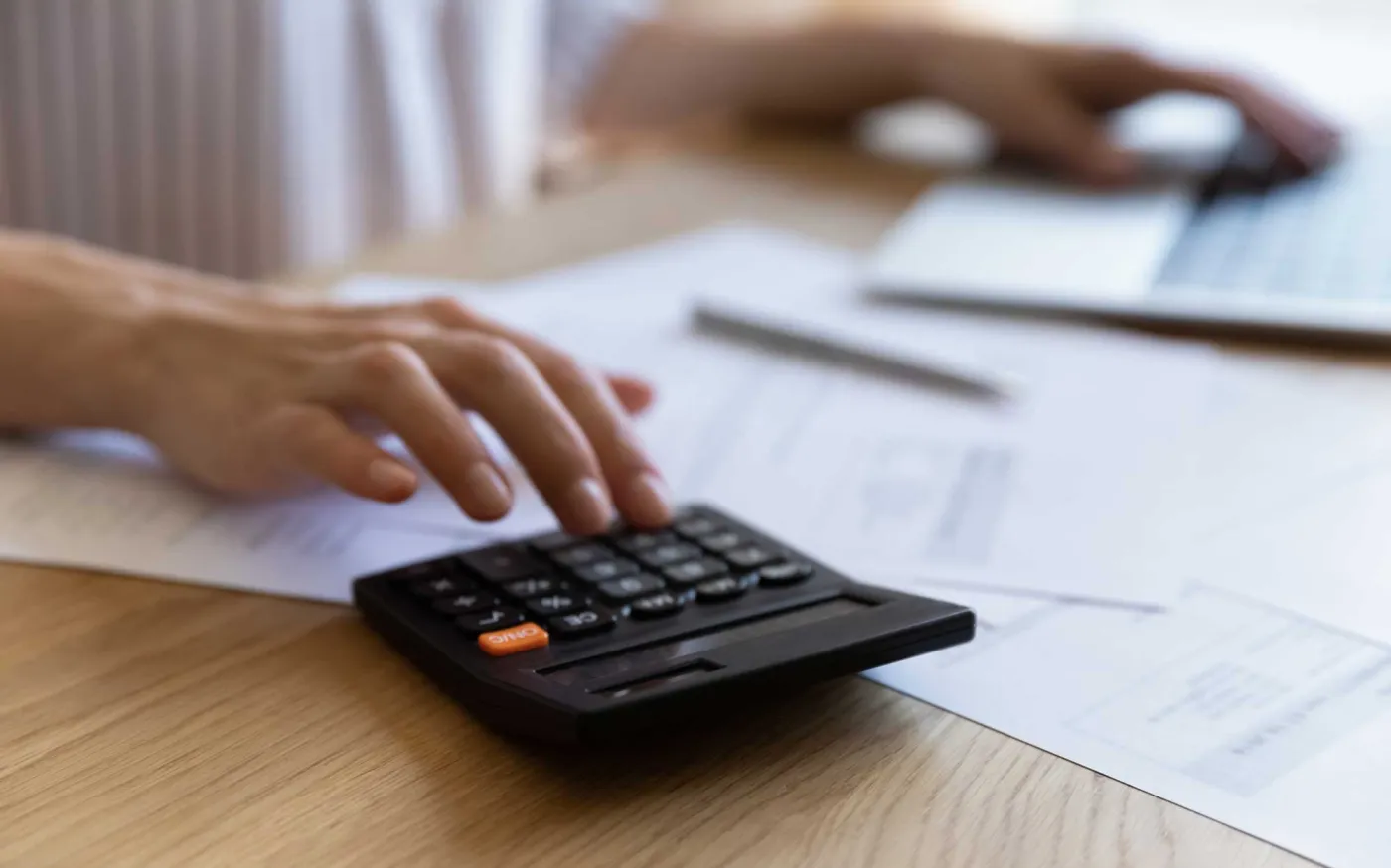 Finance professional using calculator