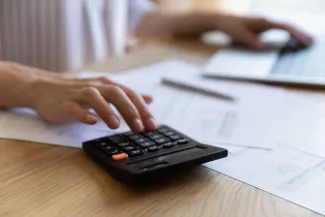 Finance professional using calculator