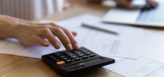 Finance professional using calculator