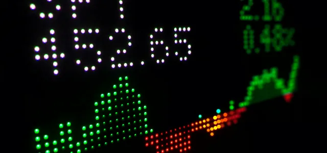 a close up of a clock with different colored numbers by Tyler Prahm courtesy of Unsplash.